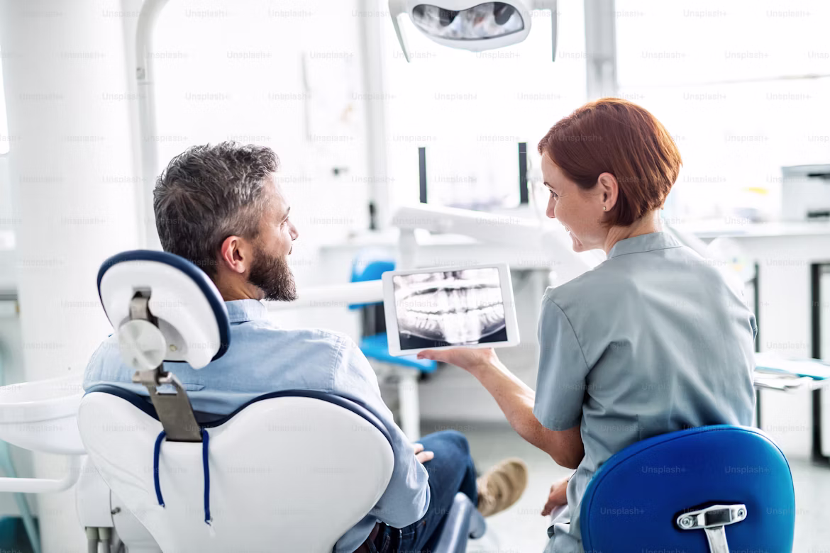 Dentist treating a patient with a smile